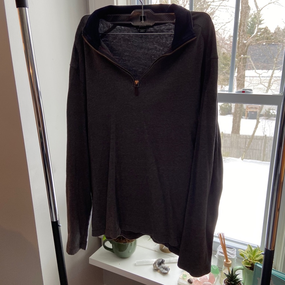 Gray quarter zip sweater.